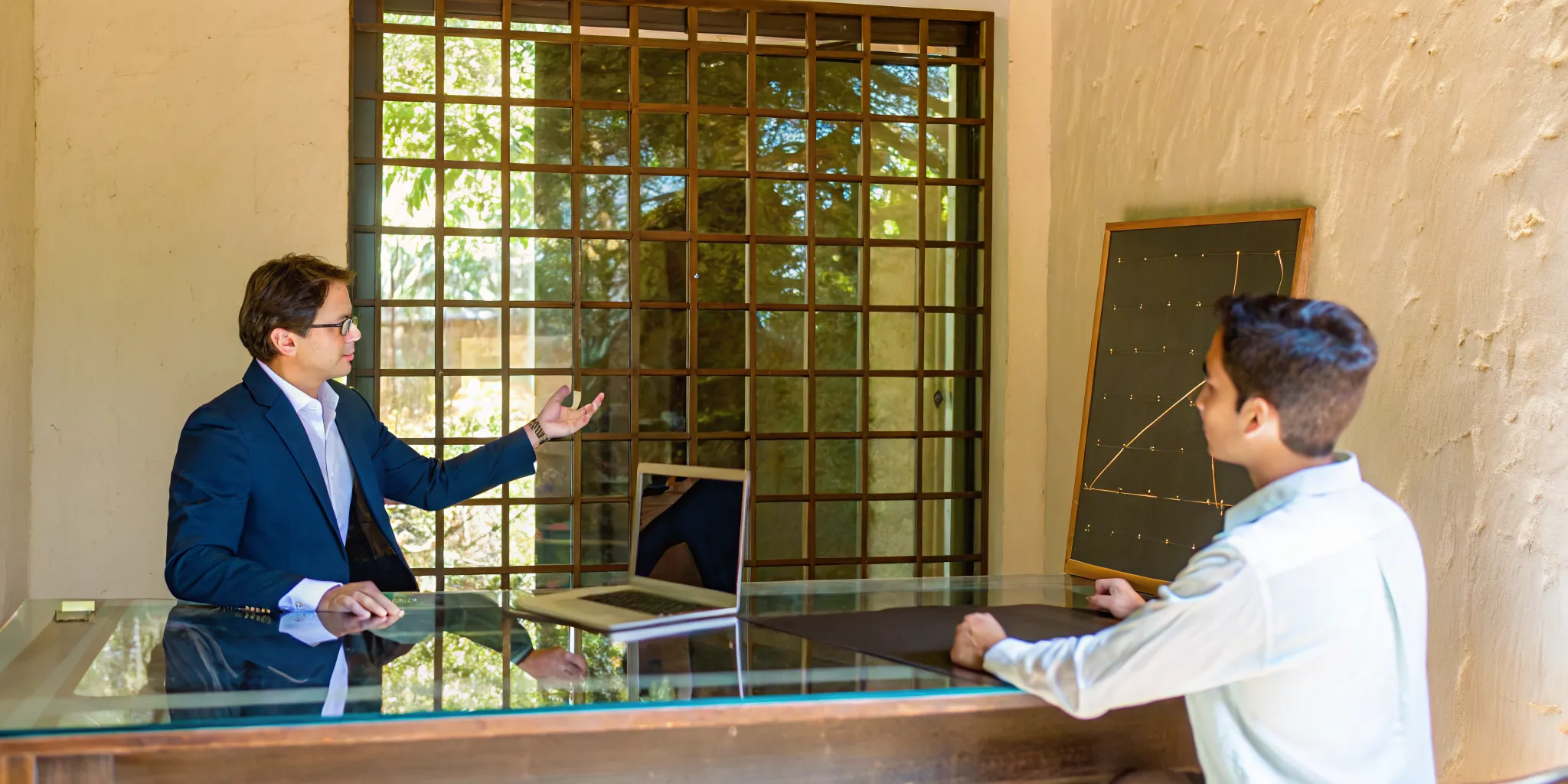 A private LSAT tutor works one-on-one with a student to prepare for the exam.