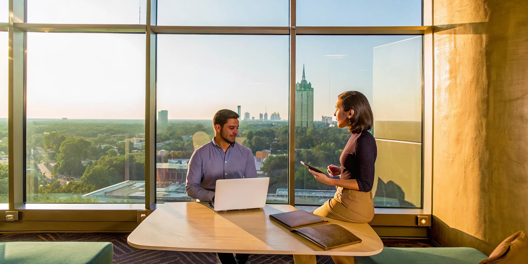 Private LSAT tutor helps a student with prep materials in a high-rise Atlanta office.