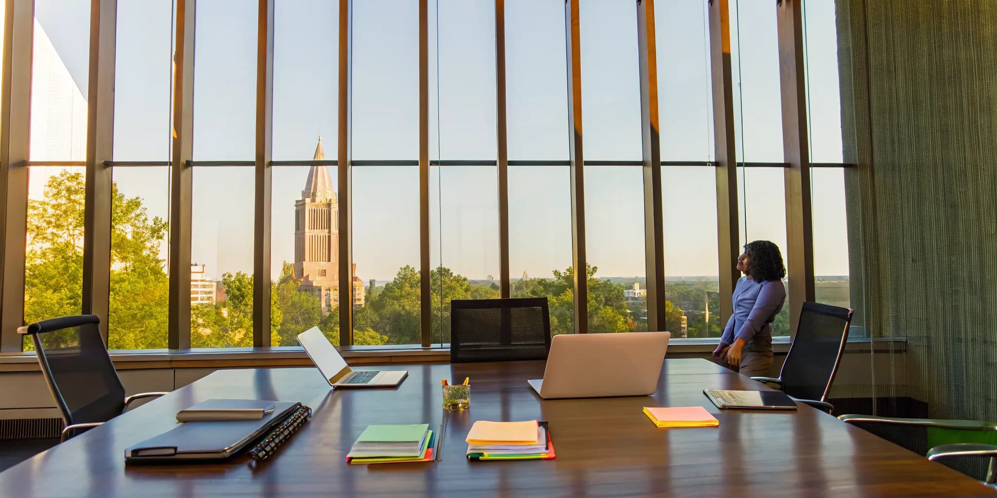 GRE prep materials on a table in an Atlanta office with a view of the city.